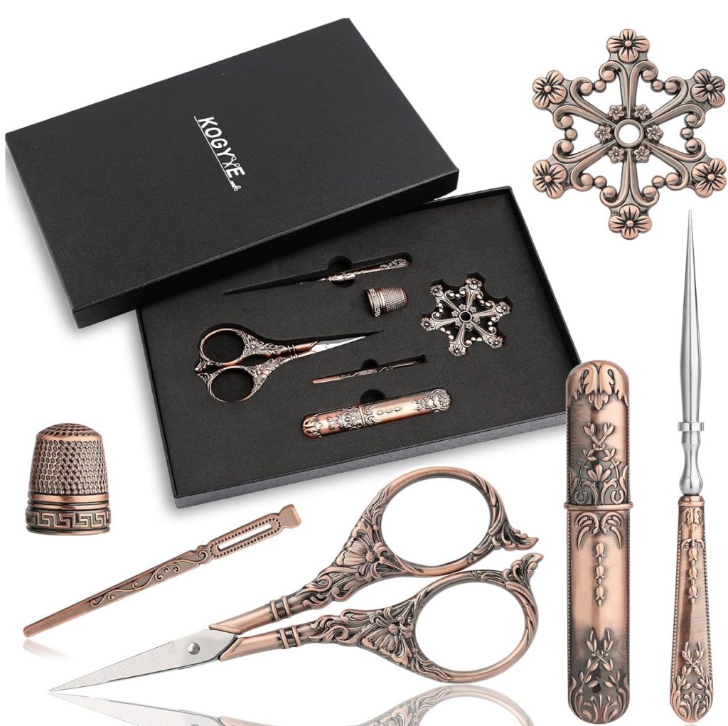 A box of tools, including scissors and tweezers, ideal for quilters as a Christmas gift.