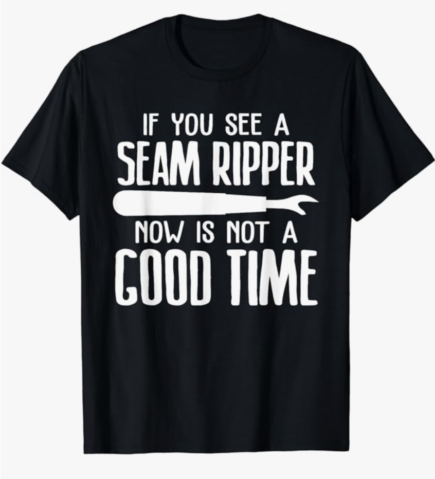 A perfect addition to Christmas gift ideas for quilters, this t-shirt humorously warns against the untimely appearance of a seam ripper.