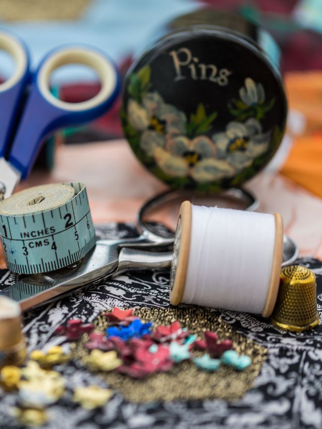 Table with sewing supplies and scissors, perfect Christmas gift for quilters.