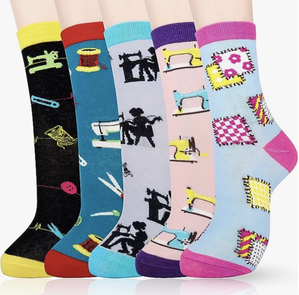 Five pairs of women's socks with sewing machines, perfect as Christmas gift ideas for quilters.
