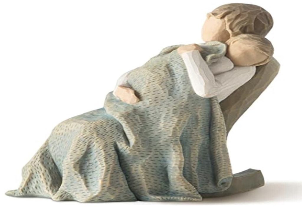 A heartfelt Christmas gift for a nanny - a figurine of a woman hugging a child.