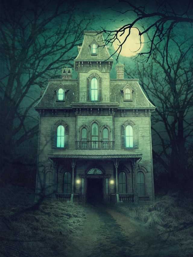 A haunted house in the woods with a full moon.