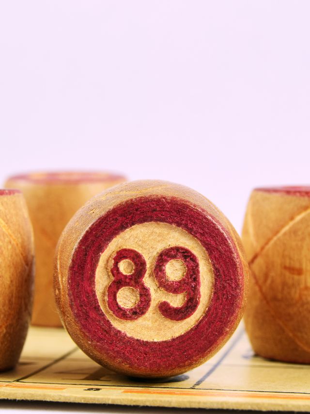 A wooden board displaying the number 89, symbolizing angelic guidance and love.