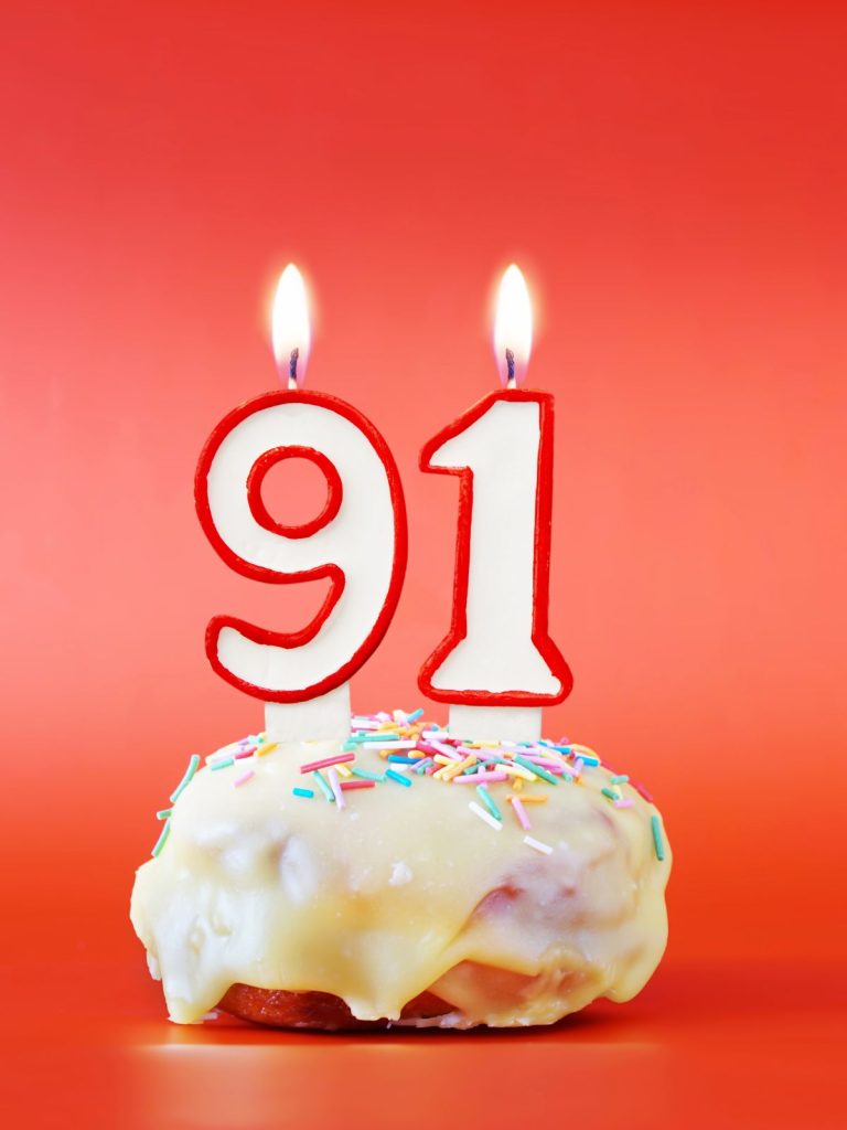 A donut with the number ninety-nine on it, symbolizing the angel number 90 meaning.