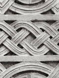 A black and white photo of a celtic design.