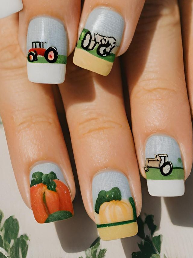 A woman's nails are decorated with a tractor and pumpkins.
