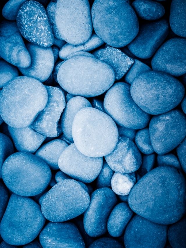 A close up of a pile of blue pebbles.