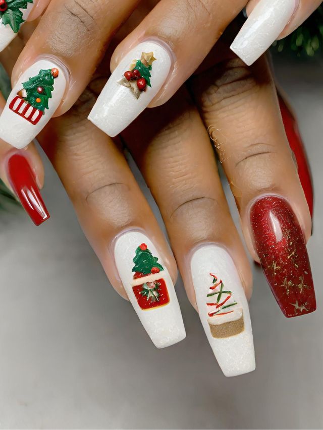 A woman's nails with christmas decorations on them.