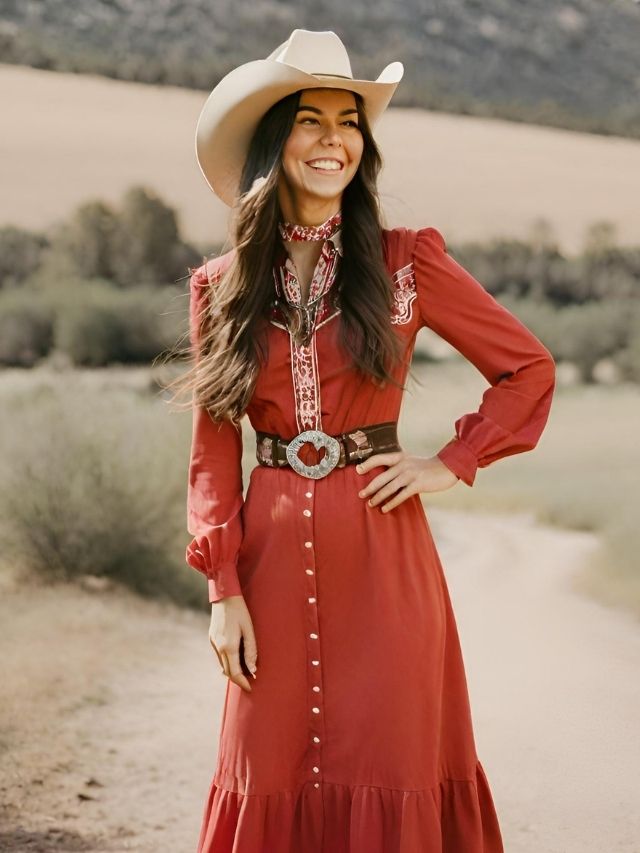 A woman wearing a red dress and cowboy hat.