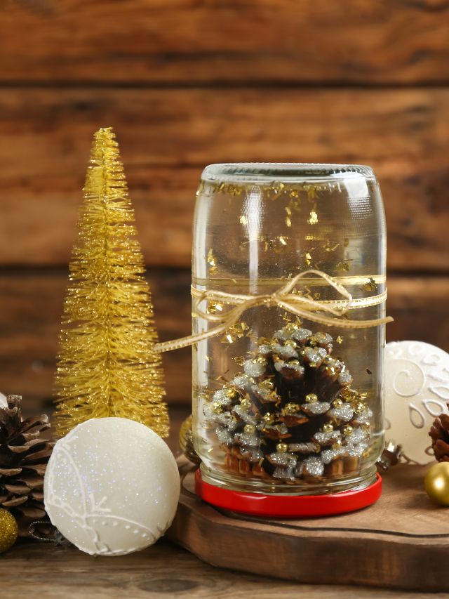 Christmas pine cones in a jar on a wooden table.
