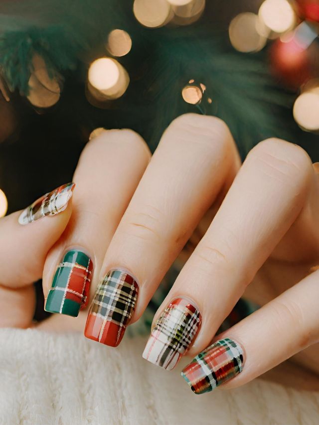 A woman is holding a christmas plaid nail polish.