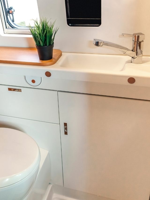 A small bathroom with a sink and toilet.