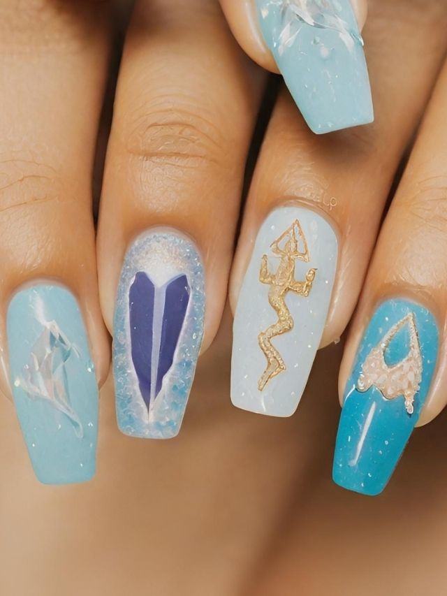 A woman's nails are decorated with blue and white designs.