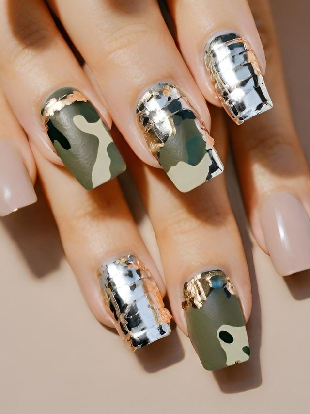A woman's nails with camouflage and gold accents.