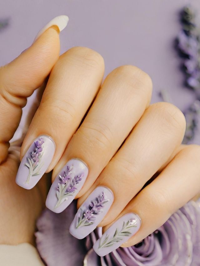 A woman's nails with lavender flowers on them.