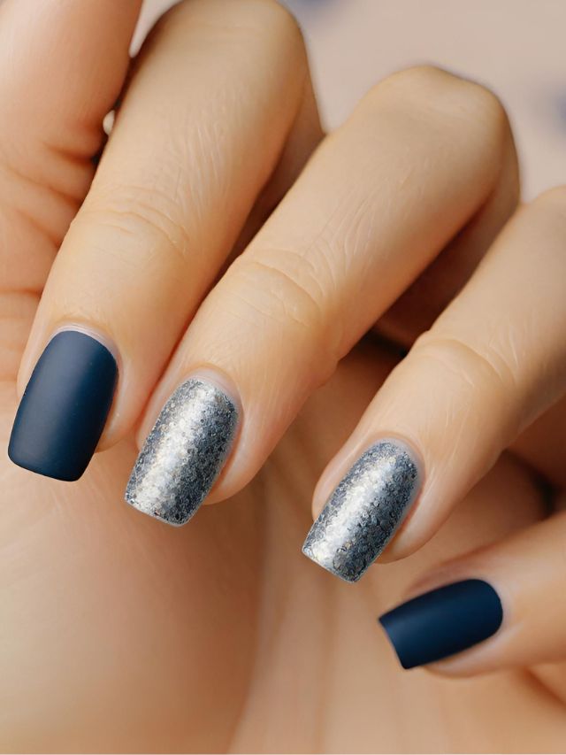 A woman's hands with blue and silver nails.