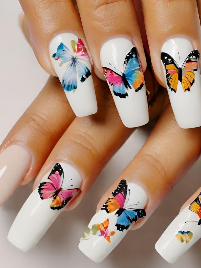 A woman's nails with colorful butterflies on them.