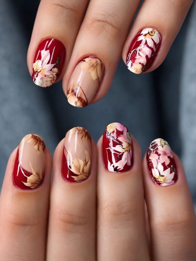 A woman's gorgeous almond nail designs showcase red and white flowers.