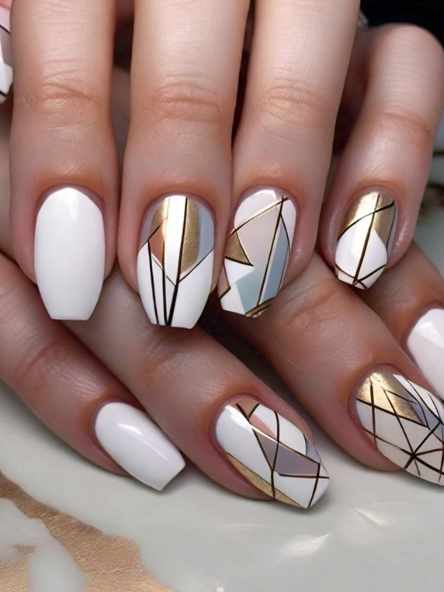 A woman with white and gold nails adorned with elegant geometric designs, showcasing luxurious nail art ideas.