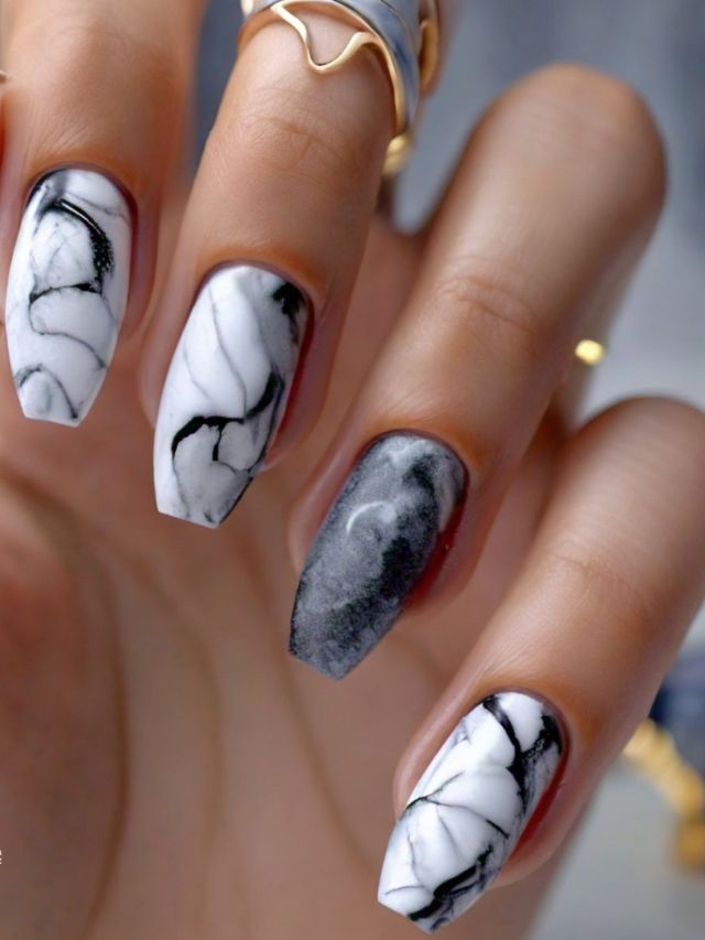 Luxury black and white marble nail designs for women.
