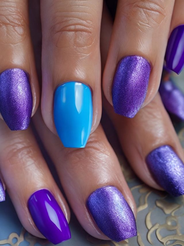 A woman's hands with purple and blue nail designs.
