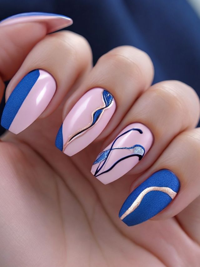 A woman's pink and blue nails with a nail art design.