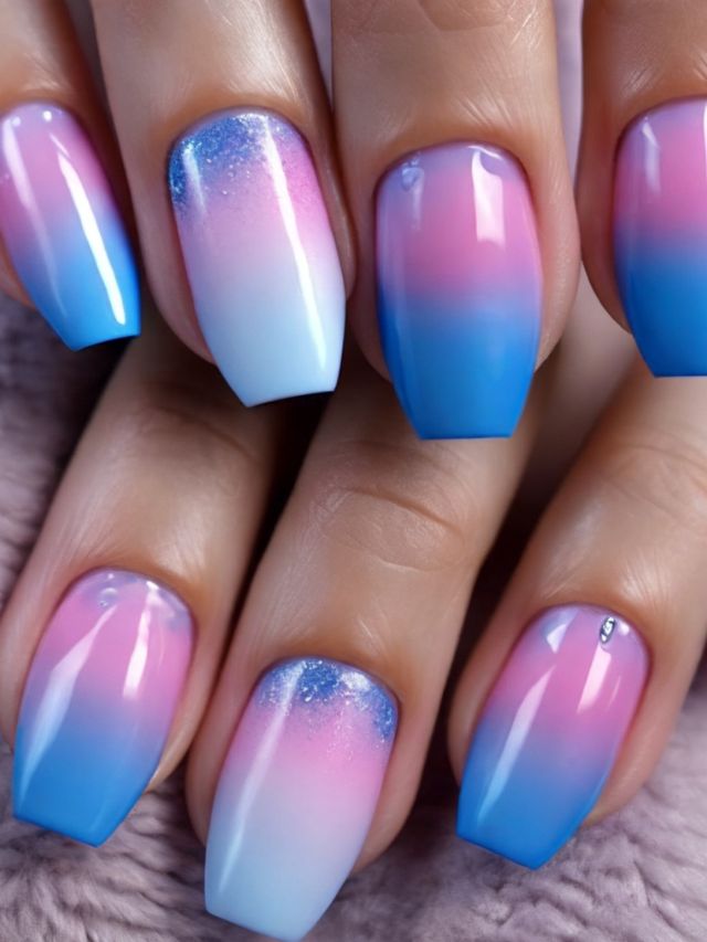 A woman's nails with ombre designs in pink and blue.