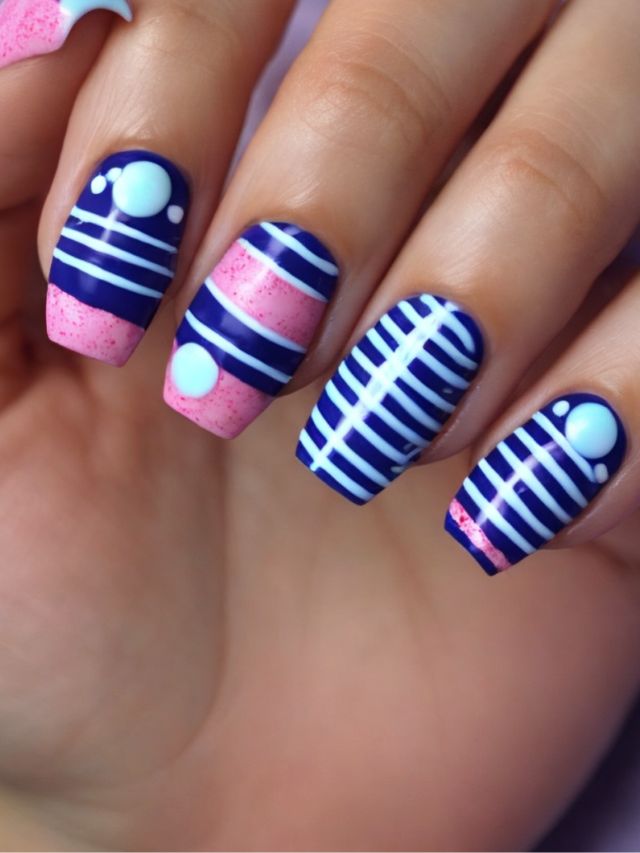 A woman's nails with pink and blue stripes on them.