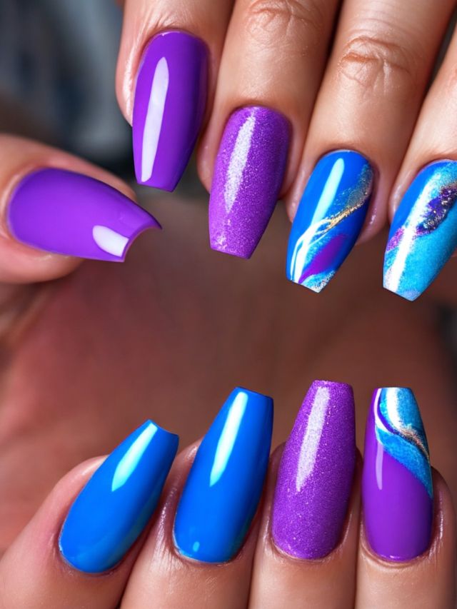 A woman's nails with pink, purple, and blue designs.