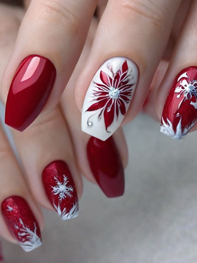 A woman's hand with gorgeous red and white almond nail designs.