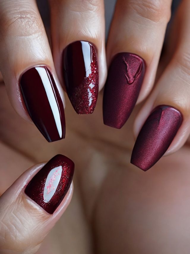 A close up of red fall nail design.