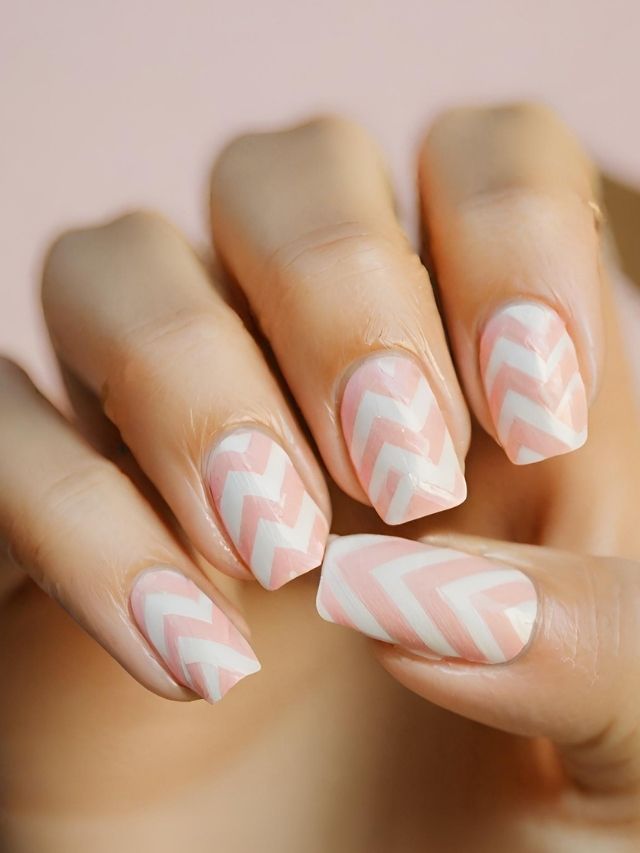 Pink and white chevron nail art.