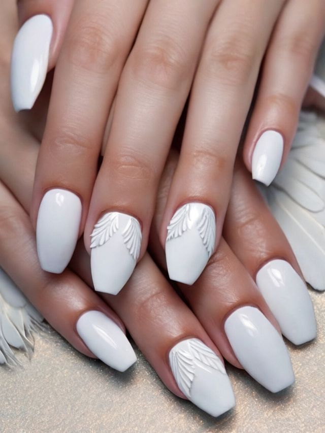 The best nail designs showcasing a woman's hands adorned with angelic white wings.