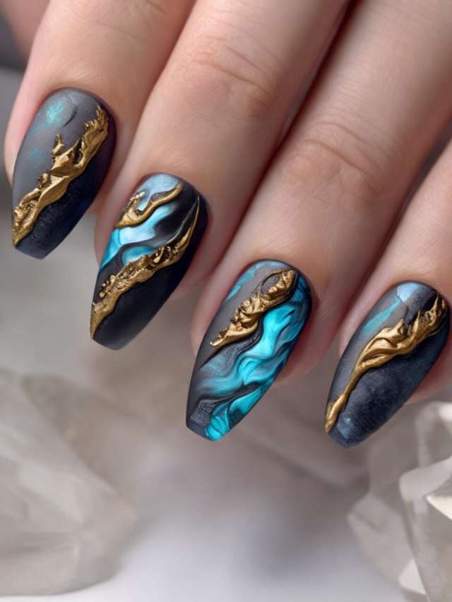 A woman's hand with black and blue nail art.
