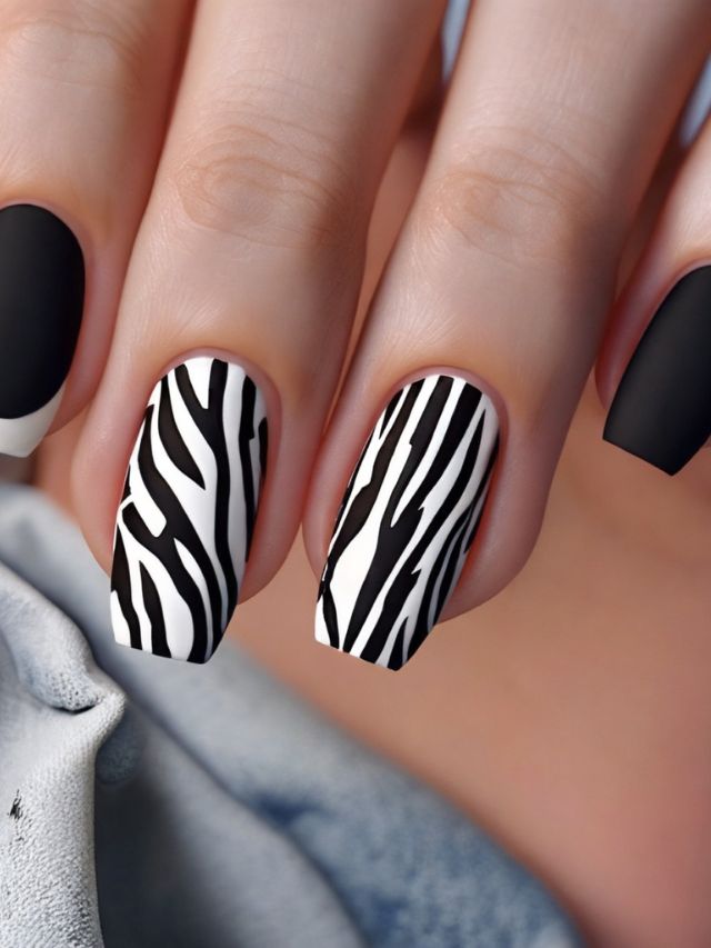 Black and white zebra print nail art.