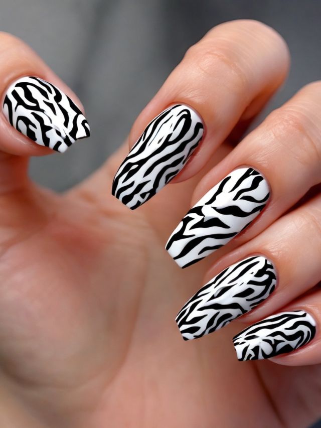 Black and white zebra print nail art.