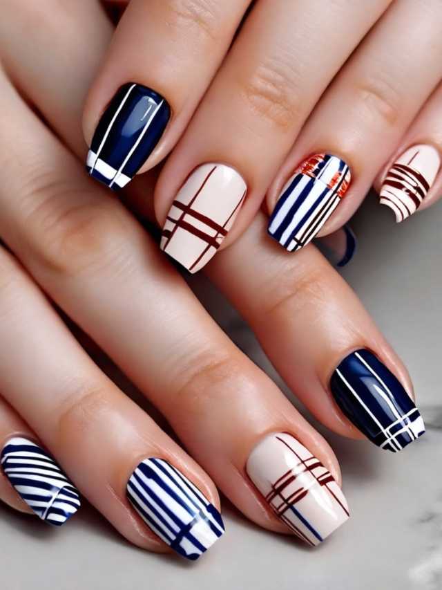 A woman with blue and white stripes on her nails.