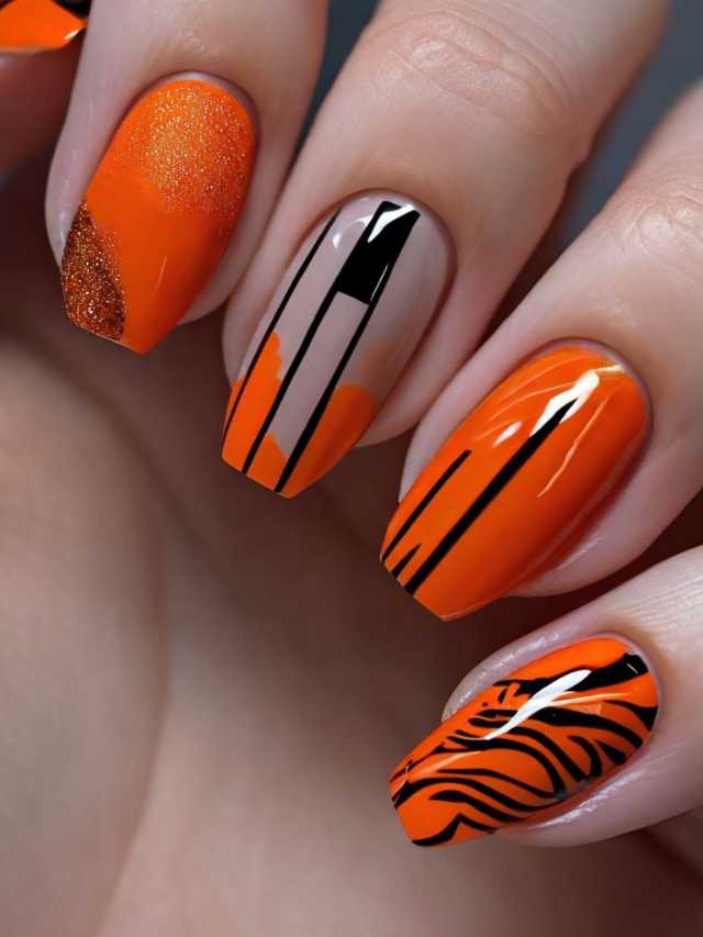 An orange nail with black and white stripes.