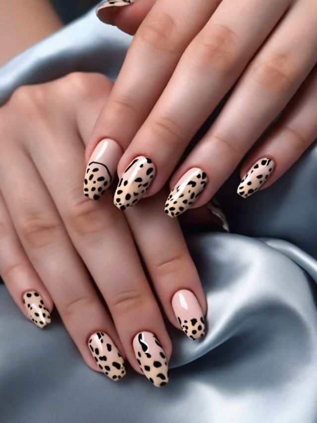 A woman's hands with leopard print nails.