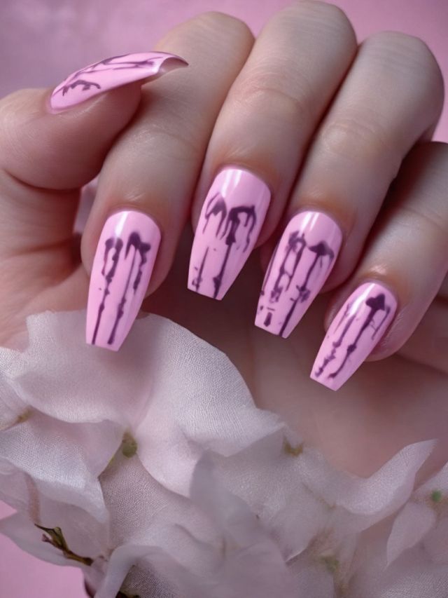 A woman holding a pink nail with arrows on it.