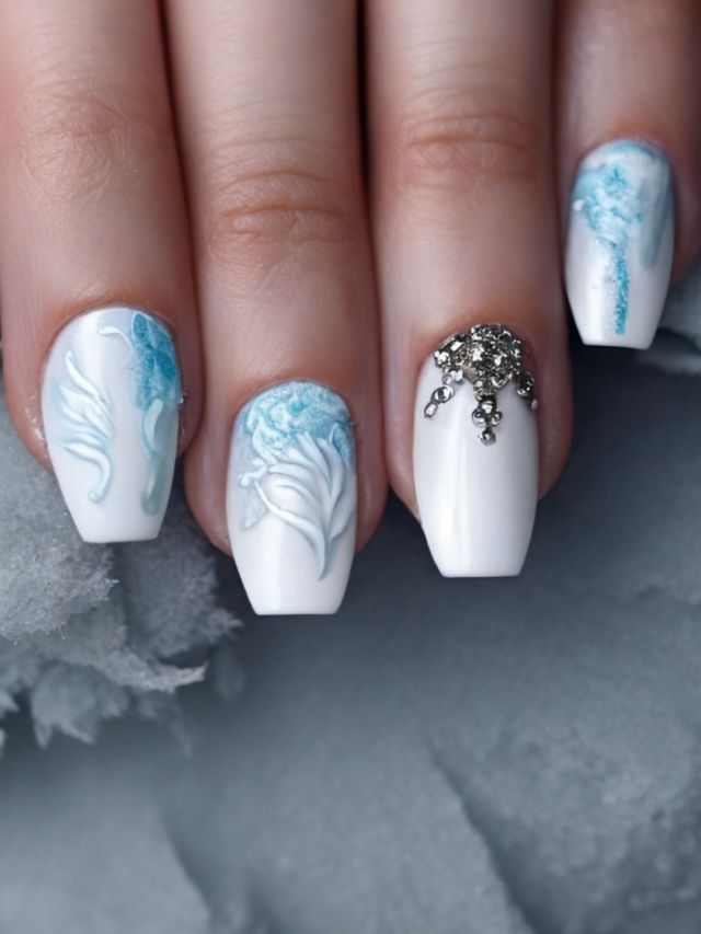 A woman's nails with blue and white designs.