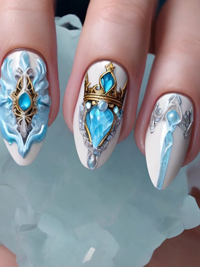A woman's nails are decorated with blue and white jewels.