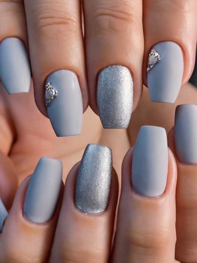 A woman's hand with grey and silver nails.