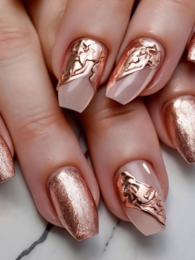 A woman's nails with rose gold designs.