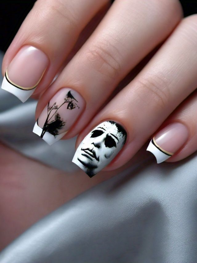 A woman's nails with a skull and crossbones design.