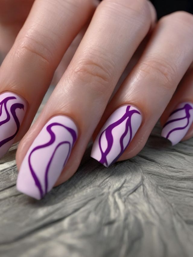 A woman's hand with purple and white nail art.