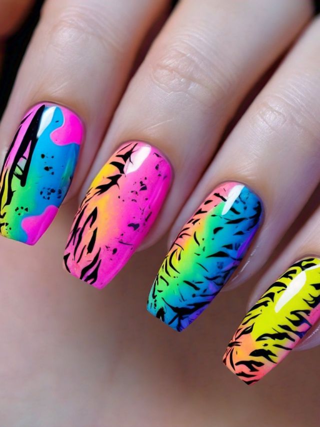 A woman holding a colorful nail with a tiger print on it.