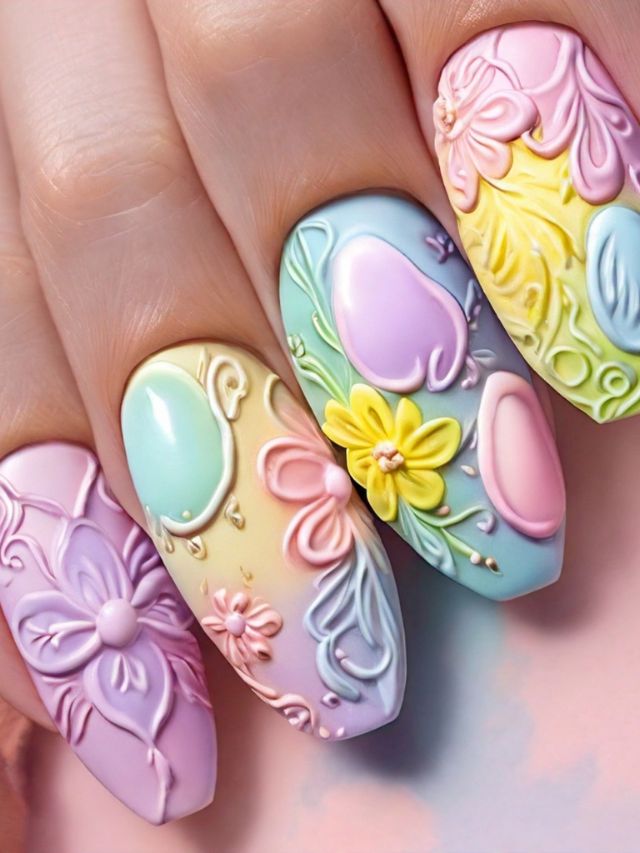 A woman's nails are beautifully adorned with delicate flower and butterfly designs, perfect for Easter nail ideas.