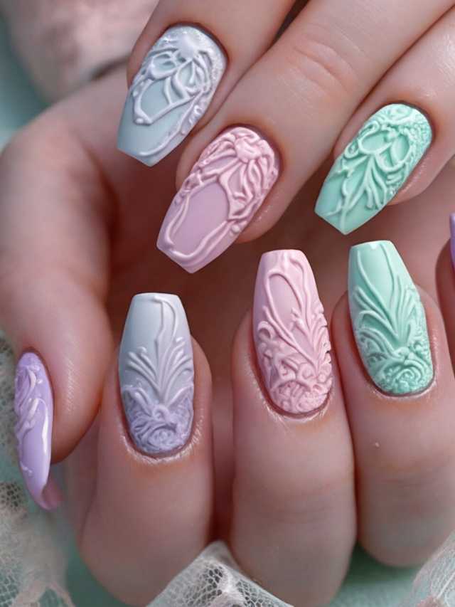 A woman's nails are decorated with pastel colors.