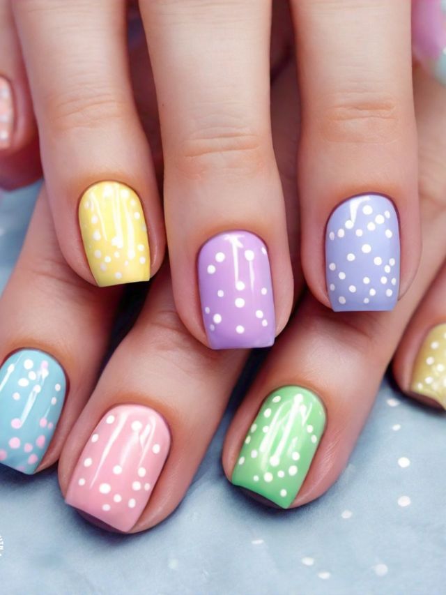 The best Easter nail designs featuring a woman's hands adorned with colorful polka dot nails.